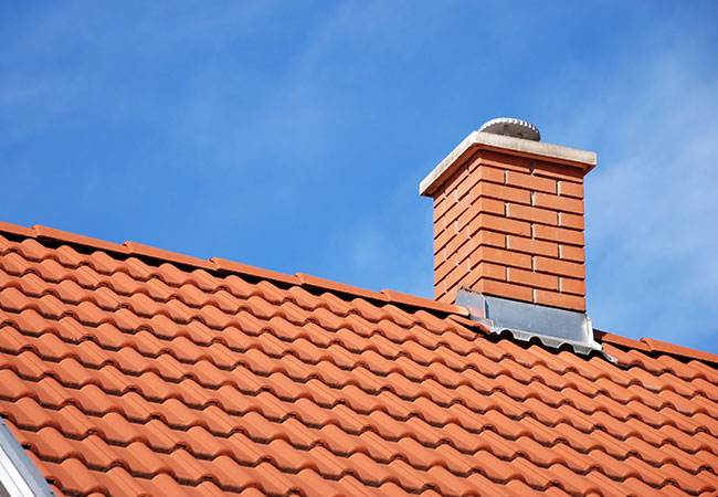 Masonry experts repairing a brick chimney in Orange County NY