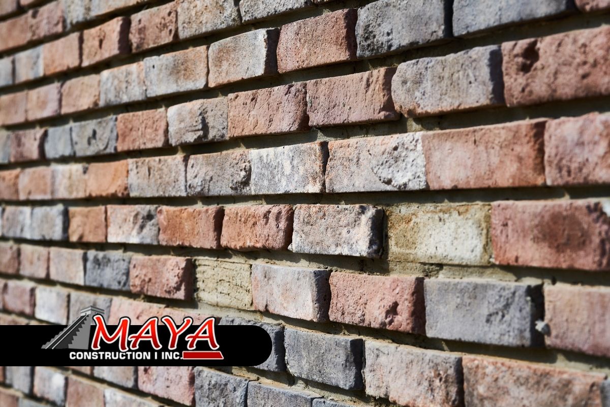 Homeowner using masonry repair tips to fix a brick wall
